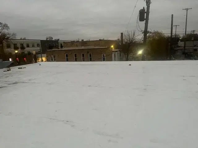 Flat roof covered in snow